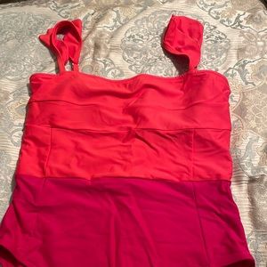 Summersault on trend red-orange/hot pink one piece color blocked swimsuit.